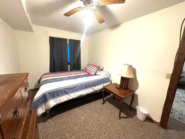 10285 237th Ave, Spirit Lake, IA 51360 - carpeted bedroom with a ceiling fan and baseboards
