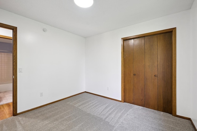 8341 Abbott Ave N, Brooklyn Park, MN 55443 - unfurnished bedroom featuring carpet floors and a closet