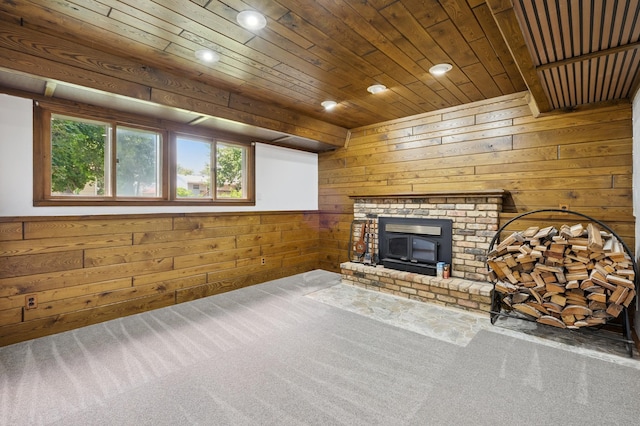 8341 Abbott Ave N, Brooklyn Park, MN 55443 - unfurnished living room featuring carpet, wooden walls, recessed lighting, a brick fireplace, and wood ceiling
