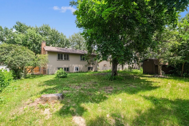 8341 Abbott Ave N, Brooklyn Park, MN 55443 - view of grassy yard featuring a shed