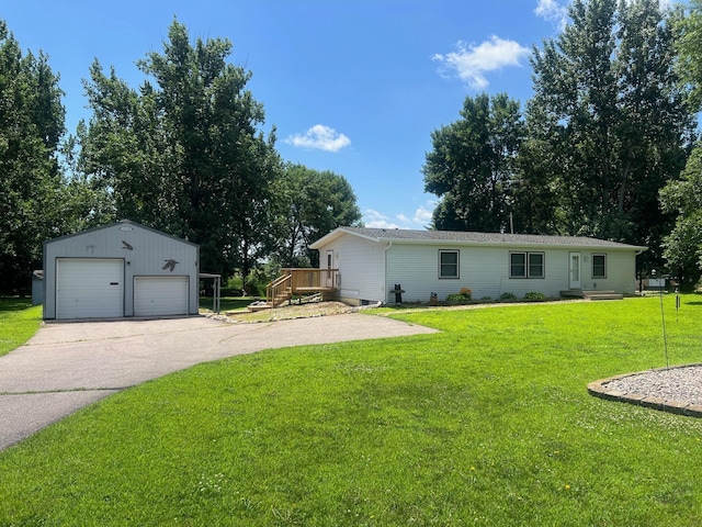 62871 230th St, Litchfield, MN 55355 - view of front of house with an outbuilding, a detached garage, and a front yard