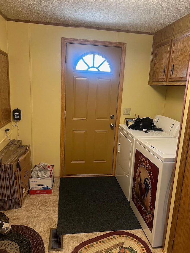 62871 230th St, Litchfield, MN 55355 - laundry room with a textured ceiling, separate washer and dryer, and cabinet space
