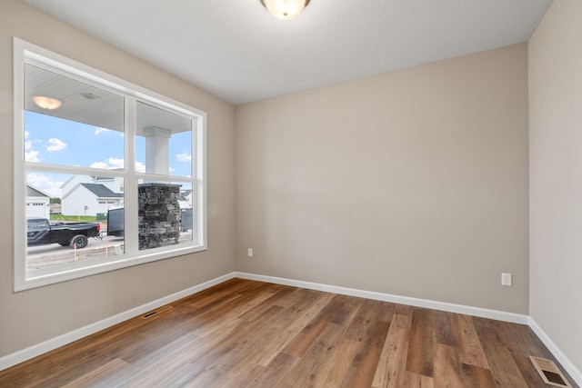 17233 61st St NE, Otsego, MN 55374 - unfurnished room featuring baseboards and wood finished floors