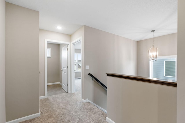 17233 61st St NE, Otsego, MN 55374 - hallway with an upstairs landing, carpet floors, a chandelier, and recessed lighting