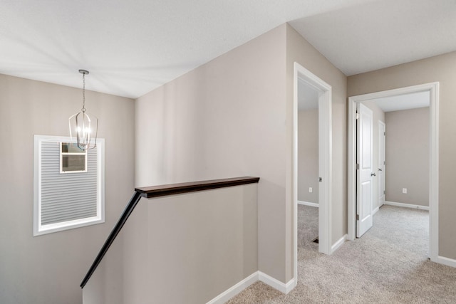 17233 61st St NE, Otsego, MN 55374 - hall featuring an upstairs landing, a chandelier, and light carpet