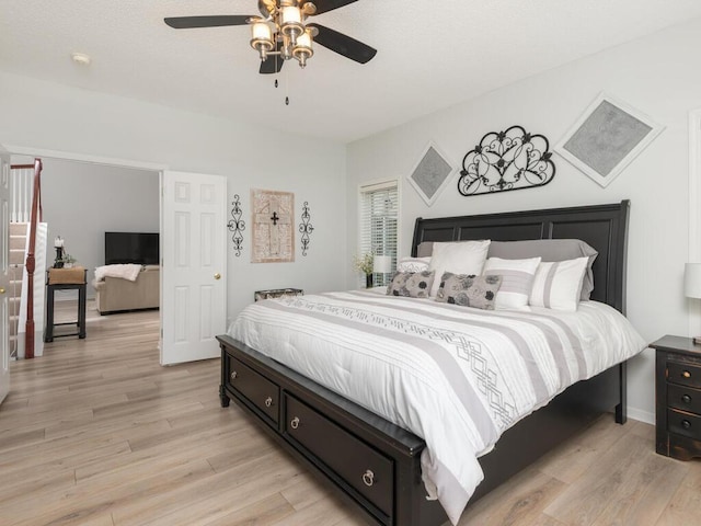 2606 Boulder Way, Burnsville, MN 55337 - bedroom with light wood-style floors and a ceiling fan
