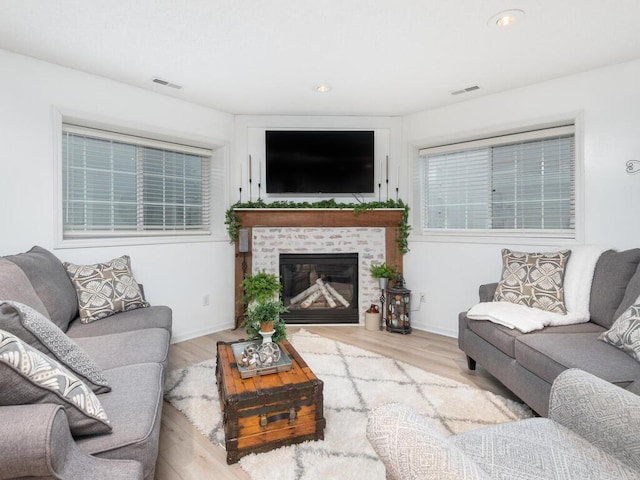 2606 Boulder Way, Burnsville, MN 55337 - living area with wood finished floors, a fireplace, and recessed lighting