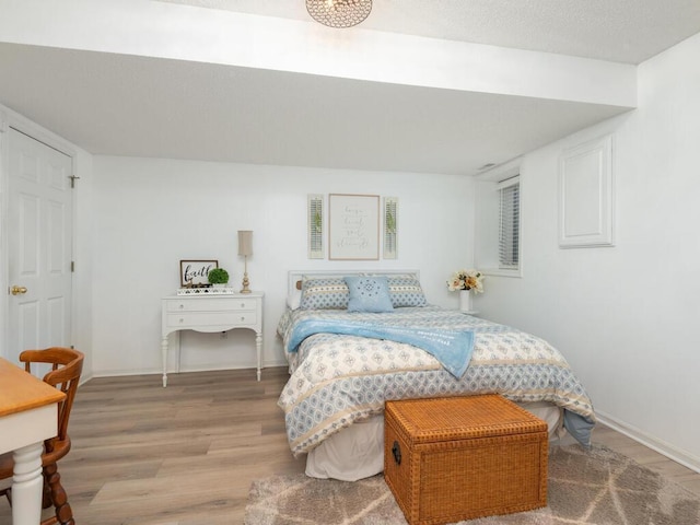 2606 Boulder Way, Burnsville, MN 55337 - bedroom featuring wood finished floors and baseboards