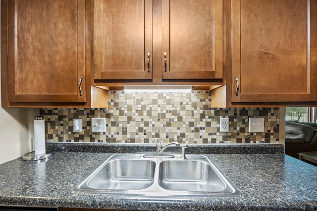 30675 Park St Unit 209, Lindstrom, MN 55045 - kitchen with decorative backsplash and brown cabinets