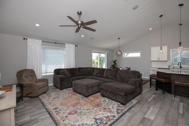 3875 Virgo Ln SW, Rochester, MN 55902 - living room featuring ceiling fan, light wood-style flooring, recessed lighting, and high vaulted ceiling