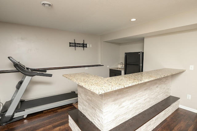 3875 Virgo Ln SW, Rochester, MN 55902 - kitchen with freestanding refrigerator, dark wood finished floors, a peninsula, recessed lighting, and light stone counters