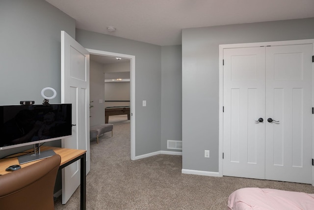 3875 Virgo Ln SW, Rochester, MN 55902 - bedroom featuring light carpet, a closet, and an office area