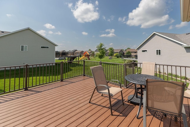 3875 Virgo Ln SW, Rochester, MN 55902 - wooden deck with a playground, a residential view, and a yard