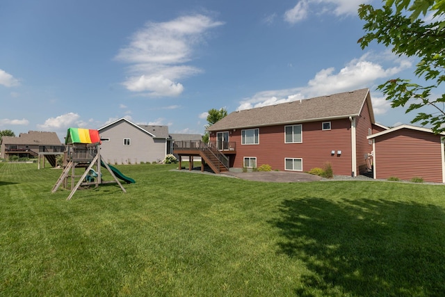 3875 Virgo Ln SW, Rochester, MN 55902 - view of grassy yard featuring a playground, a patio, stairs, and a wooden deck