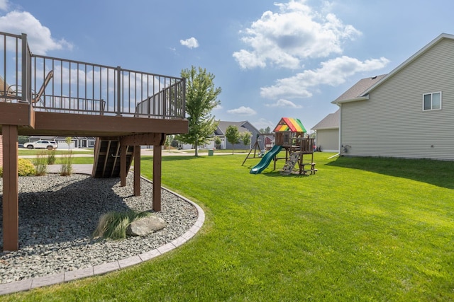 3875 Virgo Ln SW, Rochester, MN 55902 - view of green lawn with a playground and a wooden deck