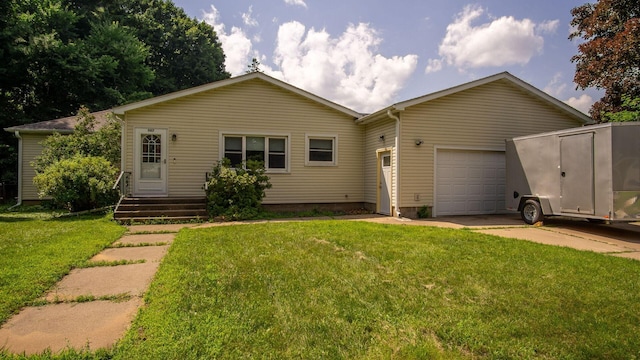 507 15th St SE, Menomonie, WI 54751 - view of front facade featuring an attached garage, concrete driveway, and a front lawn