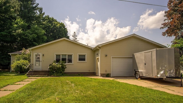507 15th St SE, Menomonie, WI 54751 - view of front of house with an attached garage, concrete driveway, and a front yard