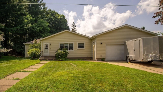 507 15th St SE, Menomonie, WI 54751 - ranch-style house with driveway, a garage, and a front lawn