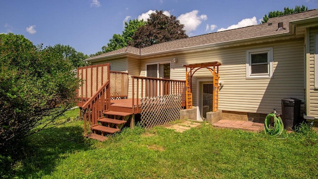 507 15th St SE, Menomonie, WI 54751 - back of house featuring a wooden deck, a lawn, crawl space, and a shingled roof
