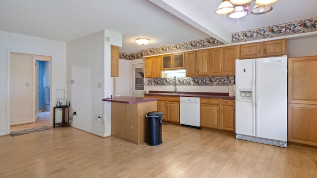 507 15th St SE, Menomonie, WI 54751 - kitchen featuring white appliances, light wood-style flooring, a chandelier, beamed ceiling, and glass insert cabinets