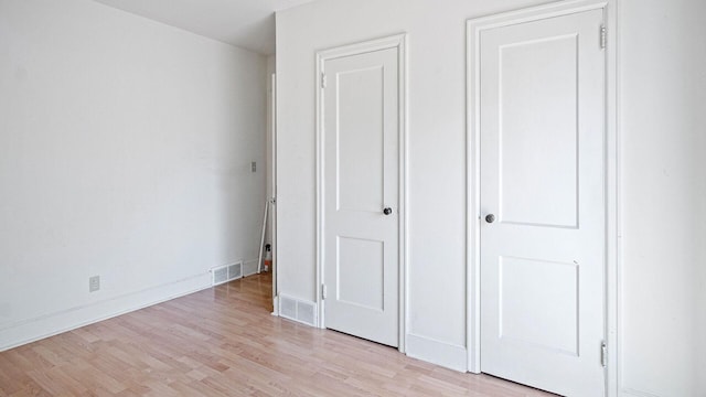 507 15th St SE, Menomonie, WI 54751 - unfurnished bedroom with light wood-type flooring and baseboards