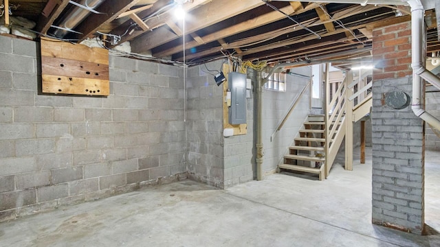 507 15th St SE, Menomonie, WI 54751 - below grade area featuring electric panel and stairway