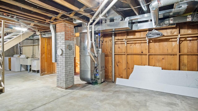 507 15th St SE, Menomonie, WI 54751 - unfinished below grade area with washer and dryer and heating unit