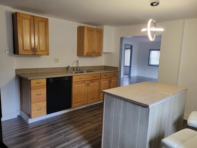 1410 5th St, Saint Paul Park, MN 55071 - kitchen featuring black dishwasher, dark wood finished floors, brown cabinetry, and hanging light fixtures
