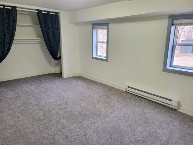 1410 5th St, Saint Paul Park, MN 55071 - spare room with a baseboard radiator and carpet flooring