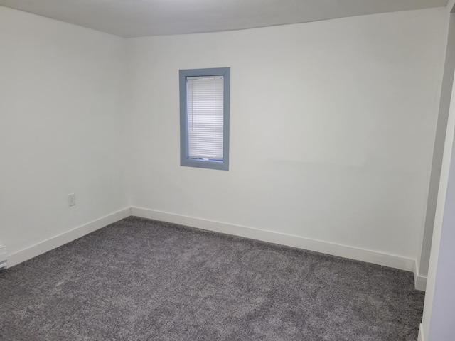 1410 5th St, Saint Paul Park, MN 55071 - unfurnished room with dark carpet and baseboards