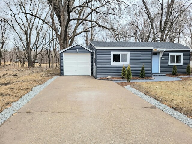 1410 5th St, Saint Paul Park, MN 55071 - view of front of home featuring concrete driveway and a shingled roof