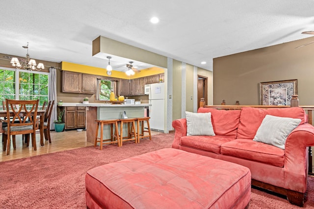 5781 Needham Ave NE, Saint Michael, MN 55376 - living area featuring a ceiling fan, light carpet, a chandelier, and recessed lighting