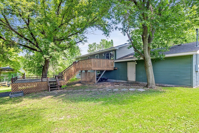 5781 Needham Ave NE, Saint Michael, MN 55376 - rear view of house with a lawn, stairs, and a wooden deck