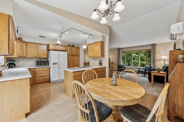 487 Lois Ln, Lino Lakes, MN 55014 - dining space with light wood finished floors, a chandelier, a wall mounted AC, and track lighting