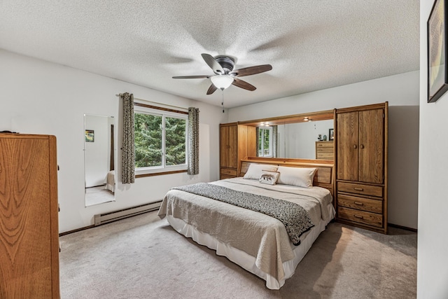 487 Lois Ln, Lino Lakes, MN 55014 - bedroom featuring a baseboard heating unit, light colored carpet, ceiling fan, and a textured ceiling