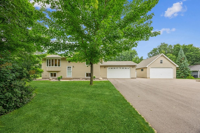487 Lois Ln, Lino Lakes, MN 55014 - raised ranch with a garage and a front lawn
