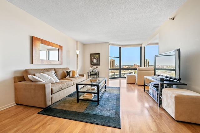 401 1st St Unit 1312, Minneapolis, MN 55401 - living room with a textured ceiling, wood finished floors, and healthy amount of natural light