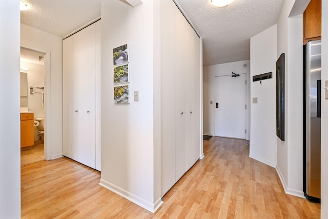 401 1st St Unit 1312, Minneapolis, MN 55401 - hall with light wood finished floors and a textured ceiling