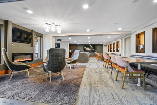401 1st St Unit 1312, Minneapolis, MN 55401 - living area featuring a glass covered fireplace, a chandelier, and recessed lighting