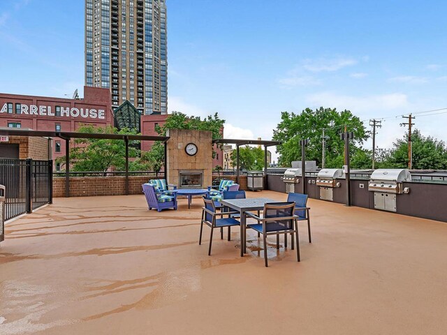 401 1st St Unit 1312, Minneapolis, MN 55401 - view of patio / terrace with an outdoor fireplace and area for grilling
