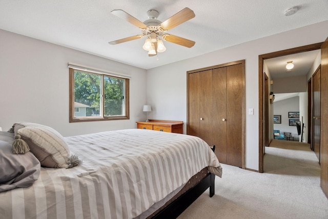 6240 Decatur Ave N, Brooklyn Park, MN 55428 - bedroom featuring light carpet, a closet, and a ceiling fan