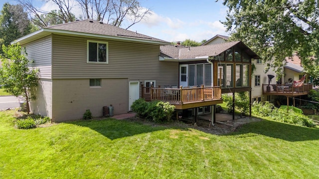 6240 Decatur Ave N, Brooklyn Park, MN 55428 - back of property with a wooden deck, a lawn, and a shingled roof