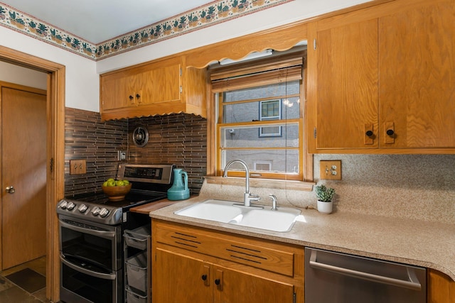 1228 Palace Ave, Saint Paul, MN 55105 - kitchen with stainless steel appliances, backsplash, light countertops, and brown cabinets
