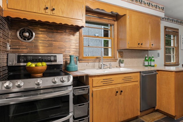 1228 Palace Ave, Saint Paul, MN 55105 - kitchen featuring stainless steel appliances, decorative backsplash, and light countertops