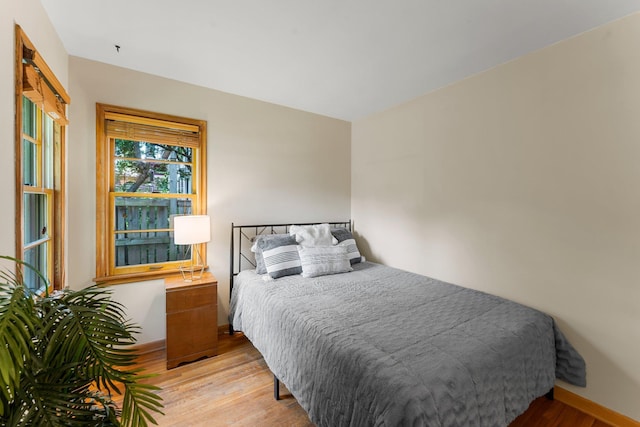 1228 Palace Ave, Saint Paul, MN 55105 - bedroom with light wood-type flooring and baseboards