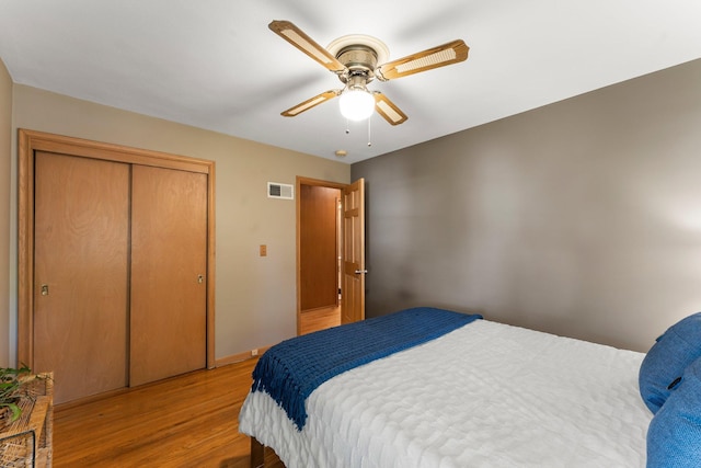 1228 Palace Ave, Saint Paul, MN 55105 - bedroom with light wood-style floors, a closet, and a ceiling fan