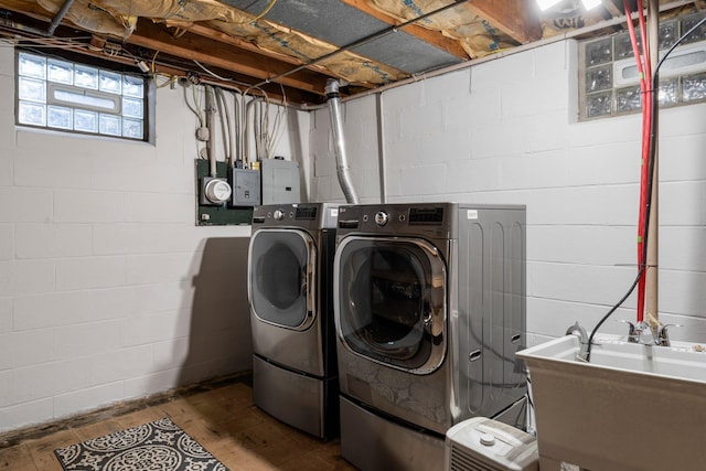 1228 Palace Ave, Saint Paul, MN 55105 - washroom with washer and clothes dryer, wood finished floors, and electric panel