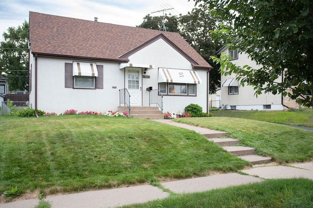 1705 California Ave E, Saint Paul, MN 55106 - view of front of property featuring a shingled roof and stucco siding