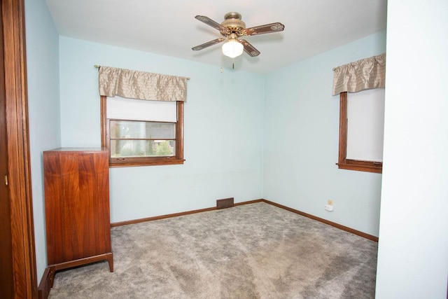 1705 California Ave E, Saint Paul, MN 55106 - unfurnished room featuring carpet flooring and a ceiling fan
