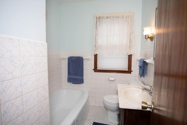 1705 California Ave E, Saint Paul, MN 55106 - full bath featuring tile walls, tile patterned floors, a tub to relax in, vanity, and wainscoting